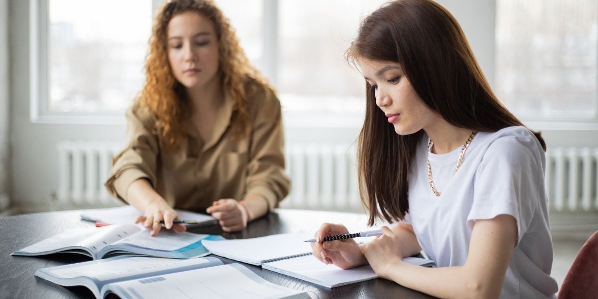 girls studying in library